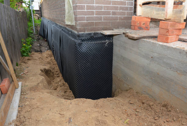 Happy homeowners after waterproofing job in Lyndonville